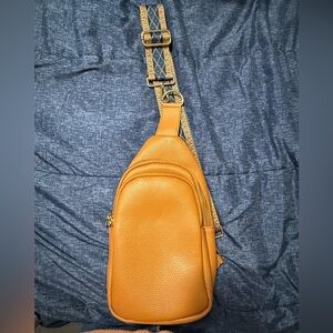 Brown sling bag with small brown wallet